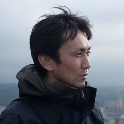 YUJI SHIMOMURA, director.